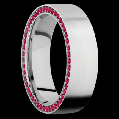 7 mm wide/Flat/14K White Gold band with a Side Eternity arrangement of .01 carat Round Ruby stones in a Bead Channel setting.