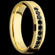 6 mm wide/Beveled/14K Yellow Gold band with an  arrangement of 9, .05 carat Round Black Diamond stones in a Bead Channel setting.