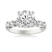 Contemporary Engagement Ring with East-West Bezel Set Oval Diamond Scalloped Shank