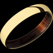 4 mm wide Domed 14K Yellow Gold band featuring a Cocobolo sleeve.