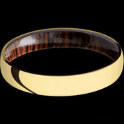 4 mm wide Domed 14K Yellow Gold band featuring a Cocobolo sleeve.