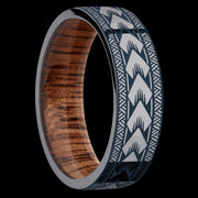 7 mm wide/Flat/Tantalum band with a laser carved Maori pattern also featuring a Koa sleeve.