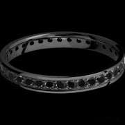 3 mm wide/Flat/Zirconium band with an Eternity arrangement of .03 carat Round Black Diamond stones in a Bead setting.