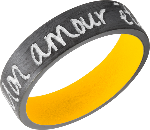 Zirconium 7mm flat band with slightly rounded edges and a laser-carved handwritten message with a yellow Cerakote sleeve