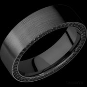 7 mm wide/Flat/Zirconium band with a Side Eternity arrangement of .01 carat Round Black Diamond stones in a Bead setting.